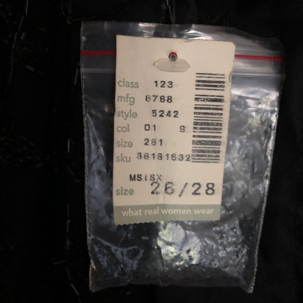 Black beaded and lined dress. Size 26-28.